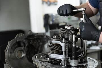 17.05.23 Kyiv, Ukraine: A craftsman who repairs mechanical parts of a car, close-up photo