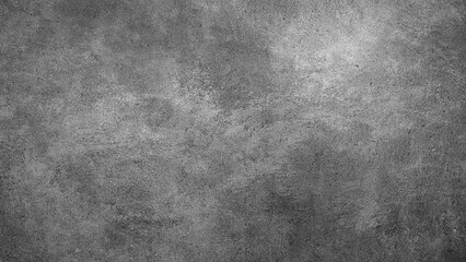 A black background with no visible objects. The background is a solid black color and has a rough texture