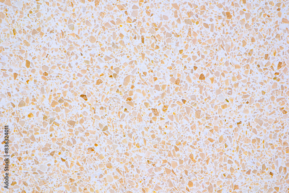 Poster A background with a lot of different colored rocks scattered all over it. The rocks are of various sizes and colors, creating a visually interesting and unique pattern
