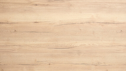 A wooden surface with a grainy texture. The wood is brown and has a natural look. The surface is...