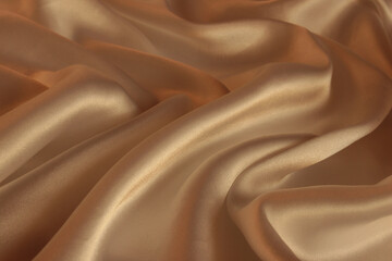 Draped gold silk fabric background