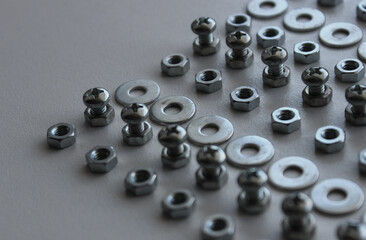 Metal Steel Fastener And Fixing Parts In Even Lines On Plastic Surface Detailed Stock Photo. Ironware Goods Royalty Free Background