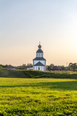 SUZDAL, RUSSIA - Beautiful landscape of Suzdal overlooking the Kamenka River and the ancient Russian Church of Elijah the Prophet (Ilyinsky Church)At sunset