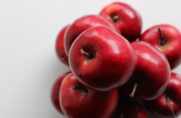 Pile Made With Juicy Red Apples On White Surface. Stock Photo Of Apples On A Shelf At Grocery Store 
