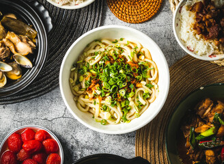 Craftsman Spicy Oolong noodles with spring onion served in plate isolated on grey background top view of assorted taiwan food