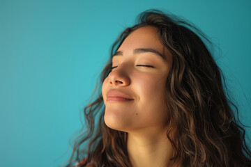 Fototapeta premium A close up of a woman's face with her eyes closed looking to a side
