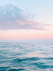 Obraz premium Tranquil Pastel Sunset Over Calm Sea - Serene Seascape with Copyspace.