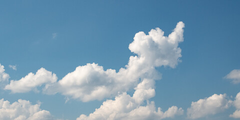 Cumulus humilis (cumuliform) clouds on the bright blue sky on a sunny day
