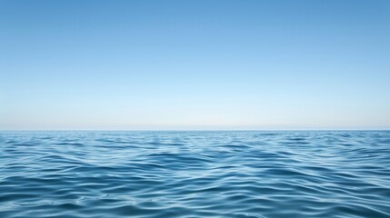 Naklejka premium Tranquil Seascape with Clear Blue Sky and Copyspace for Text, Serene View of Calm Ocean Waves - Perfect for Relaxation and Travel Concepts