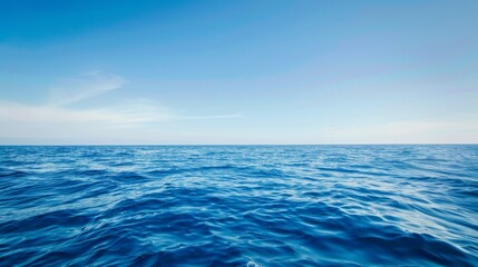 Obraz premium Tranquil Seascape with Clear Blue Sky - Peaceful Ocean Waves Background with Copyspace, Serenity and Calmness