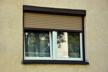 Apartment window with roller shutter