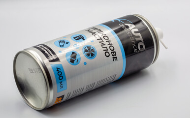 Auto Assistance silicone grease spray closeup on white.