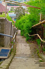 Old destroyed staircase leading down. Vertical photography.