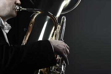 Tuba player brass instrument. Orchestra bass euphonium hands closeup. Music horn trumpet. 