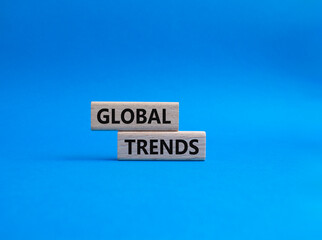 Global Trends symbol. Wooden blocks with words Global Trends. Beautiful blue background. Business and Global Trends concept. Copy space.