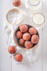 Hot and homemade mini doughnuts for Fat Thursday holiday.