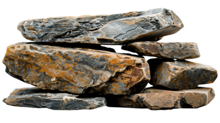 Close-up view of a stack of rugged, textured stones in varying shapes with visible layers and earthy tones.