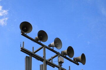 Alarm and announcement speakers elevated on a pole