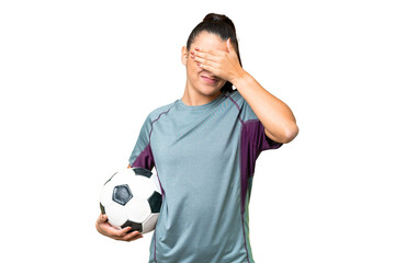 Young football player Woman over isolated chroma key background covering eyes by hands. Do not want...