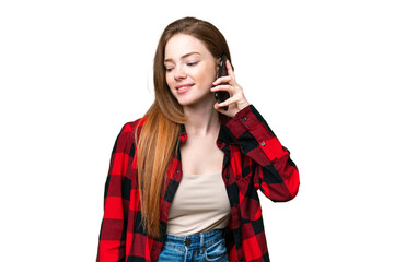 Fototapeta premium Young pretty woman over isolated chroma key background keeping a conversation with the mobile phone with someone