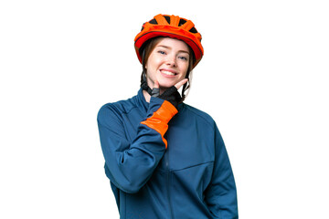 Young cyclist woman over isolated chroma key background smiling