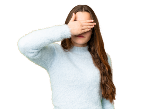 Teenager girl over isolated chroma key background covering eyes by hands. Do not want to see something
