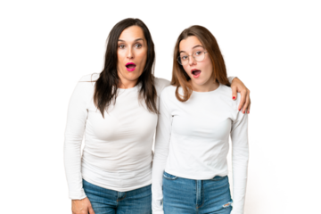 mother and daughter over isolated chroma key background with surprise facial expression