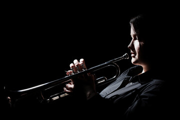 Trumpet player. Woman playing brass instrument © Alenavlad