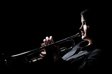 Trumpet player. Woman playing brass instrument