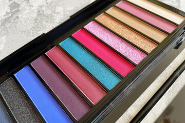 palette of multicolored eye shadow close up