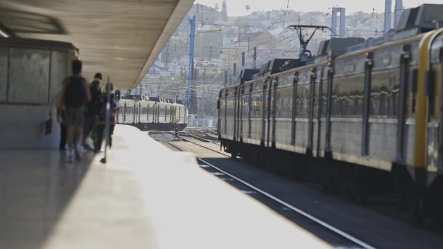 A train is sitting on the tracks at a train station