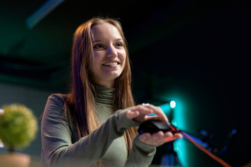 Smiling gen Z influencer presenting wired gaming mouse from brand sponsoring video, urging viewers...