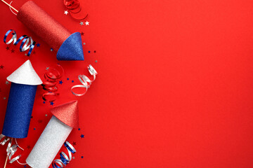 Firework rockets on red background with confetti, flat lay. Happy Independence Day banner design.