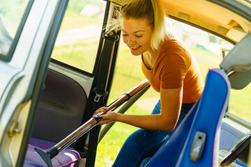 Cleaning car interior with vacuum cleaner