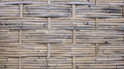 the walls of the hut are made of woven bamboo