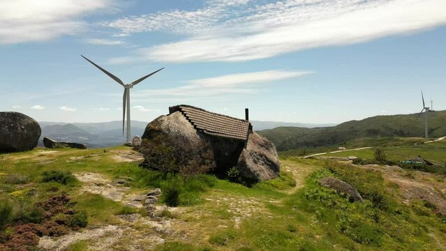 Aerial video above Casa do Penedo Boulder House in Fafe, Portugal