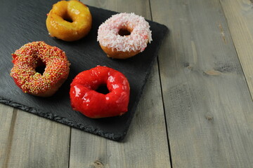 Low-calorie donuts on a gray stand with space for copy space recipe text. Delicious Diet Pastry American Food