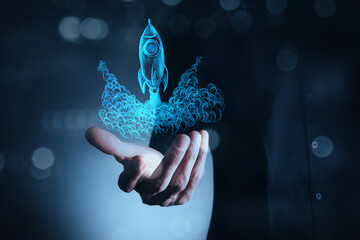 hand holding a digital glowing globe with a glowing light bulb on a dark background.