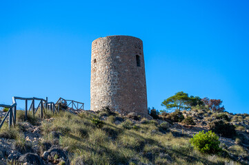Naklejka premium Sunset over historic Torre Vigia De Cerro Gordo, a watchtower looking out for any marauding pirates. La Herradura, Andulasia, Southern Spain