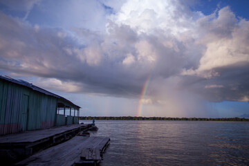 A beautiful rainbow at dusk on the Rio Negro, in the Anavilhanas river archipelago, in the Brazilian Amazon rainforest. The beauties of nature.