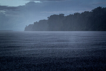 A storm on the Rio Negro, inside the Anavilhanas river archipelago in the Brazilian Amazon rainforest. A beautiful afternoon in the forest.