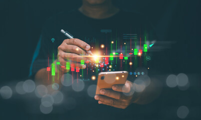 Businessman pointing candlestick chart for analysis data to trading. Stock market and financial...