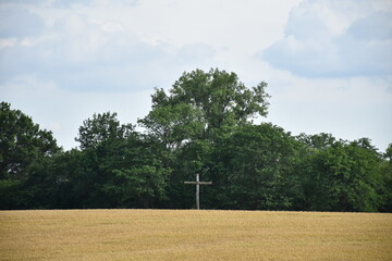 Cross on a Hill in a Farm Field