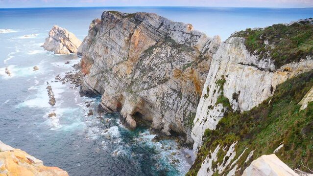 Seascape of Atlantic ocean and Asturias rocky coast at Cape Penas. Sea shore with high cliffs in north Spain.