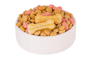Dry dog food and dog treats in white bowl isolate. Food for pets dogs.