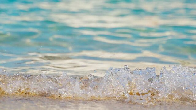 Sir Bani Yas island, United Arab Emirates, 4k, Close up view of the beach and the azure clear sea water rolling in small waves