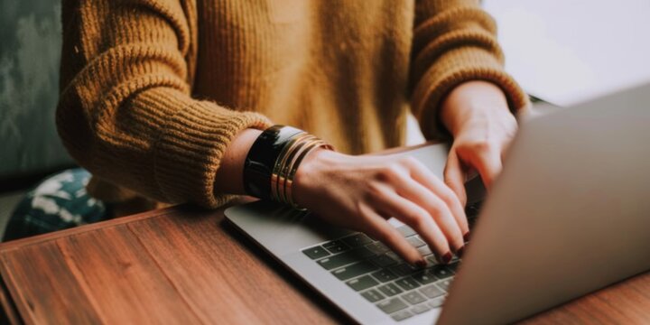 A close-up of a person using a laptop to participate in a virtual job interview