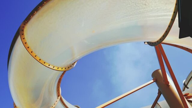 Dubai, United Arab Emirates - Jan 12 2024, 4k, Bottom-up view of the water slides, water park on the upper deck, at daytime, Dubai, United Arab Emirates 