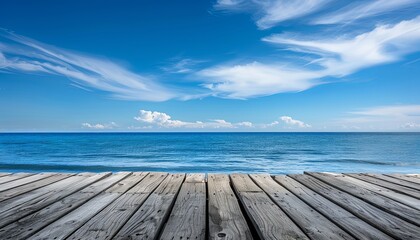 Fototapeta premium A wooden pier overlooking a calm blue ocean