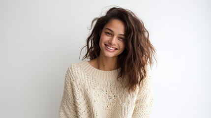 Fototapeta premium young woman with a warm glow, dressed in a cozy sweater 
